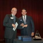 Enrique Gallegos (left), receiving an award from Don Beeler (right)